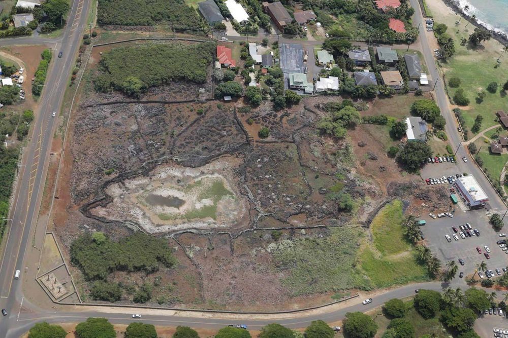 2014 aerial view. The village is now viewable from the road, with hand-carved traditional Hawaiian Ki'i blessing the site from above.